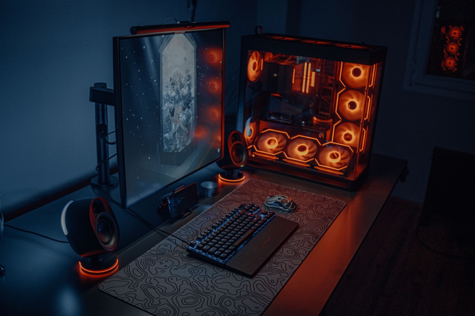 Nowoczesne stanowisko gracza z podświetlanym PC i dużym monitorem